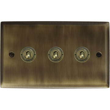spectrum antique brass toggle switch (3 gang) front fc101025