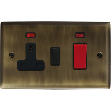 spectrum antique brass cooker switch with socket (black switch) front fc101025